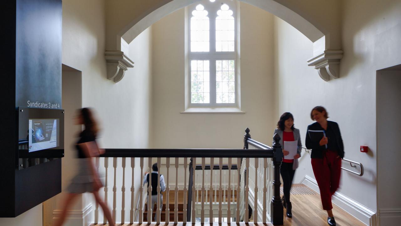 People walking through building. 