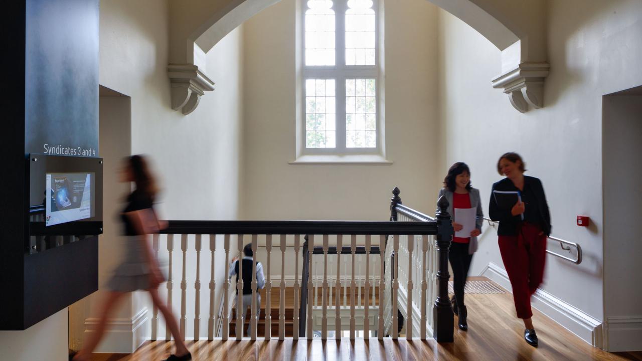 People walking through building. 