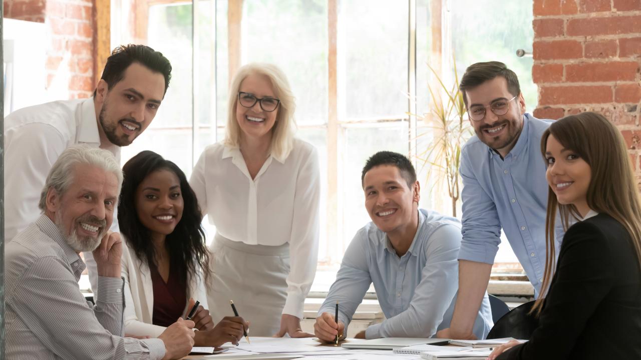 Group of diverse people working around a table