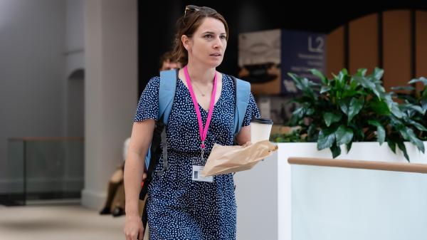 TEP graduate walking through the Academy building in East Melbourne