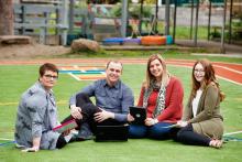 Group of teachers sitting outdoors