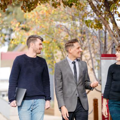 School leaders walking outside in discussion