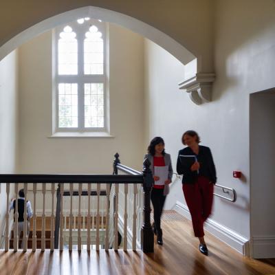 People walking through building. 